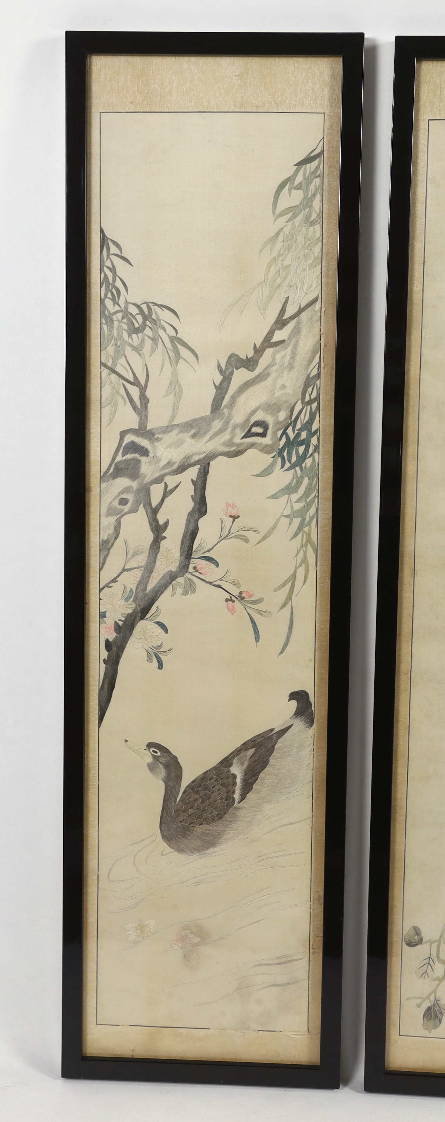 A set of four framed Chinese silk embroideries, of “The Four Seasons”, late Qing dynasty, embroidered with birds and trees and flowers, 96cm high x 22cm wide